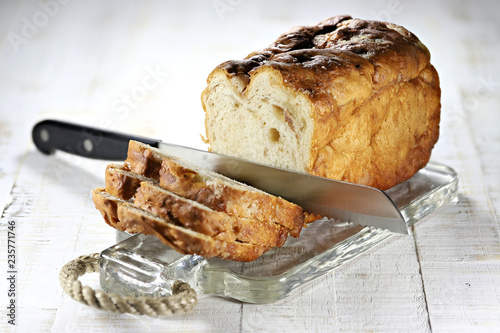 Frisian Suikerbrood (sugarbread) with knife on glass plate photo