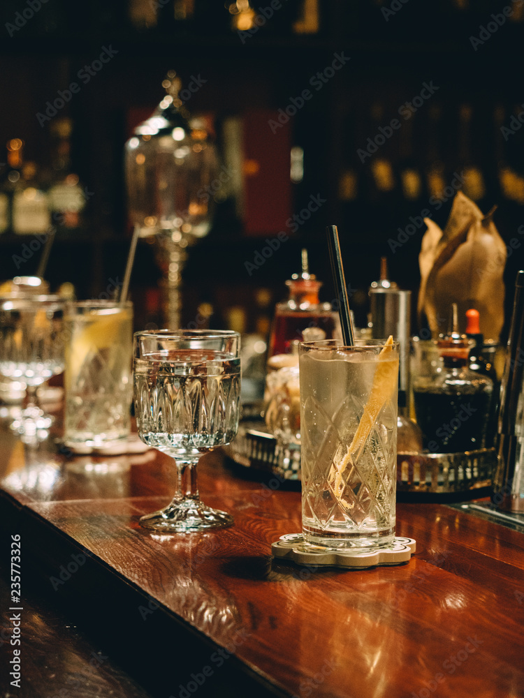 Gin tonic cocktails in glasses in bar stand