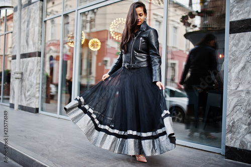 Pretty indian girl in black saree dress and leather jacket posed outdoor at street. © AS Photo Family