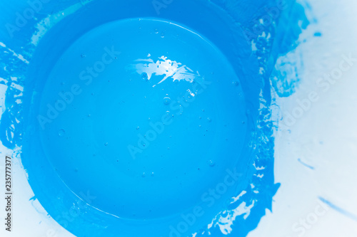 bright light blue paint in a bucket