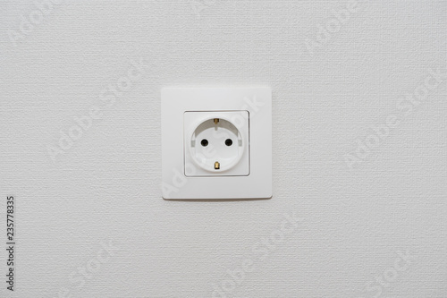 Alone outlet Electrical Socket on white baskgrounds. copy space for text , renovation , new home ownership concept