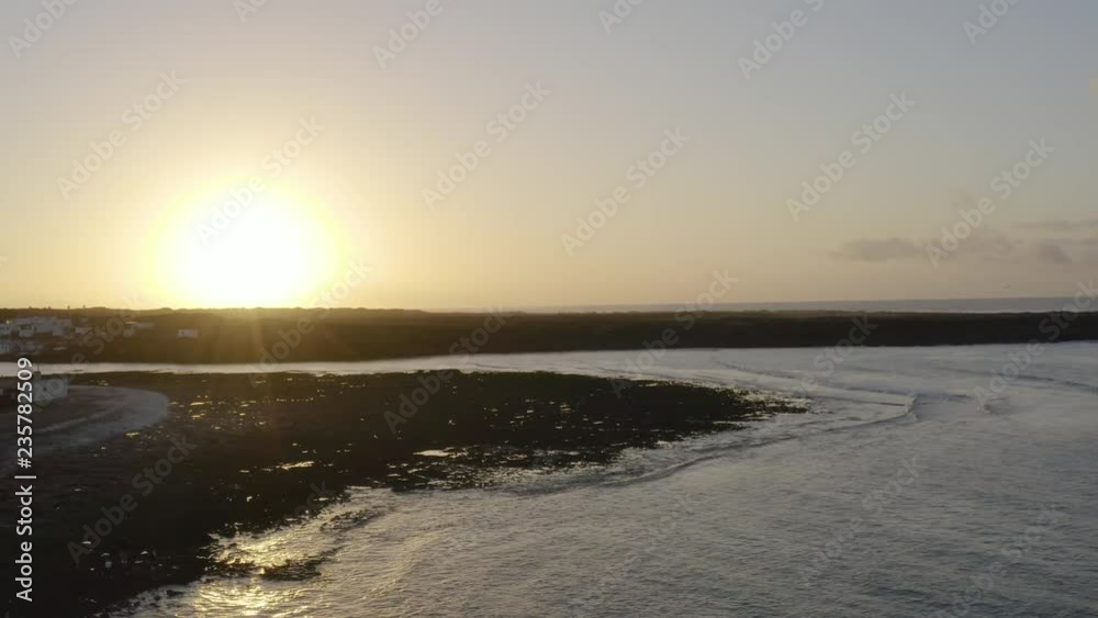 Drone aerial shot of stunning coastline on a sunset Drone aerial shot of stunning coastline on a sunset