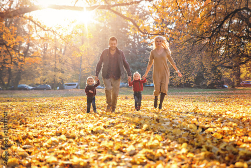 Joyful family enjoying great, autumnal weather