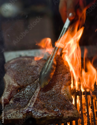 Chefs grilling steaks at the Big Texan Steakhouse, Amarillo, Texas