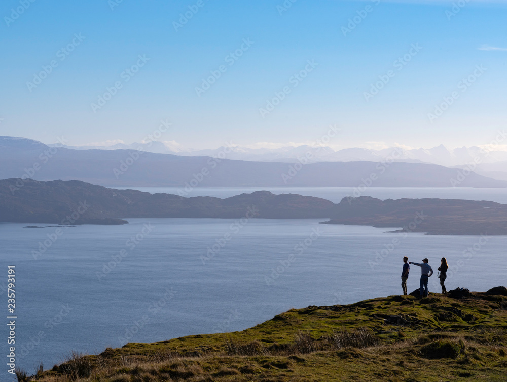 Hikers view the Sound of Raasay from Trotternish, Isle of Skye, Scotland