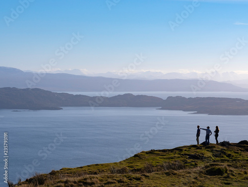 Hikers view the Sound of Raasay from Trotternish, Isle of Skye, Scotland