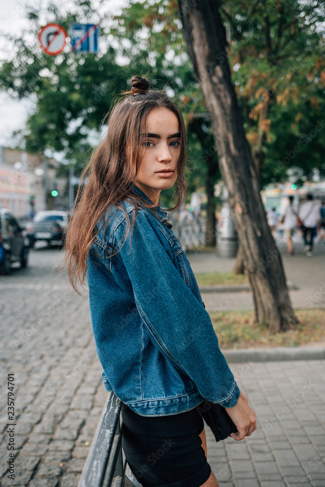 Beautiful girl in blue denim jacket and shorts Beautiful girl in blue denim jacket and shorts