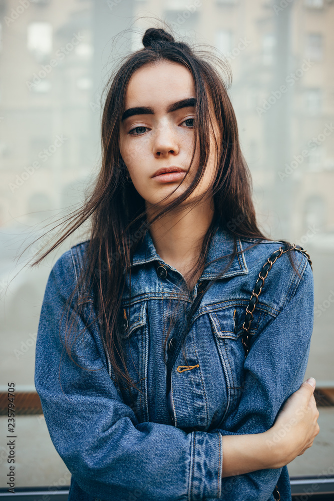 Portrait beautiful young woman dressed in classic blue denim jacket Portrait beautiful young woman dressed in classic blue denim jacket