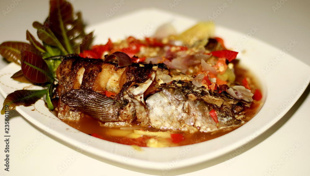 Pecak gabus or snakehead fish. Spicy and delicious. Traditional dish from Indonesia. 