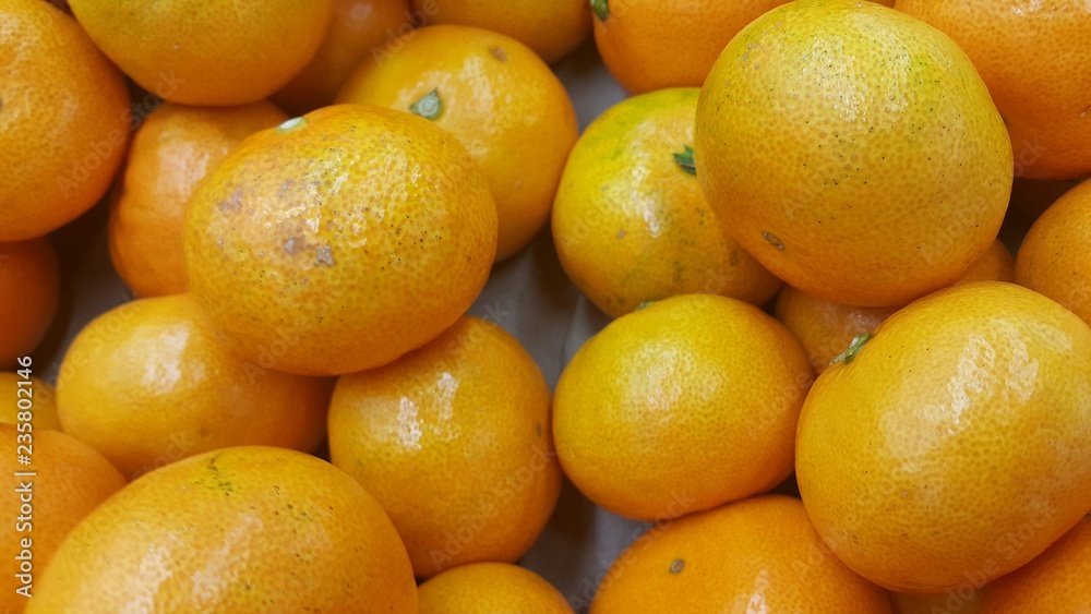 Fresh oranges in supermarket for sale, pile of orange in market for texture Fresh oranges in supermarket for sale, pile of orange in market for texture