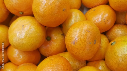 Fresh oranges in supermarket for sale  pile of orange in market for texture