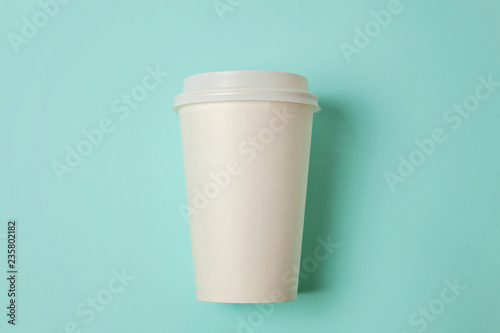 Simply flat lay design paper coffee cup on blue pastel colorful trendy background. Takeaway drink container. Good morning wake up awake concept. Template of drink mockup. Top view copy space