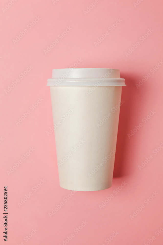 Simply flat lay design paper coffee cup on pink pastel colorful trendy background. Takeaway drink container. Good morning wake up awake concept. Template of drink mockup. Top view copy space