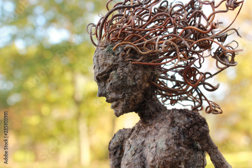 Fotografie Fantasy tree woman, hamadryad, gazes down with Autumn background