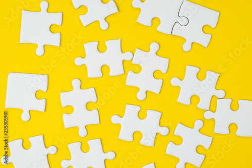 Business strategy for success metaphor or various solutions to solve problem concept, jigsaw puzzle pieces on yellow background