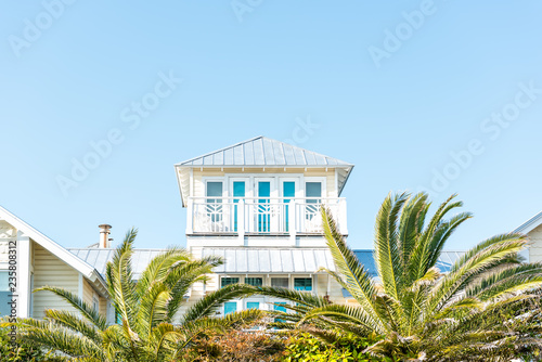 Fototapeta Naklejka Na Ścianę i Meble -  Wooden house tower new urbanism modern architecture by beach ocean, nobody in Florida view during sunny day