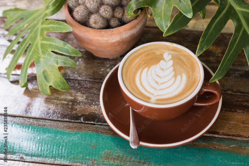 Fototapeta premium Hot coffee latte with beautiful milk foam art in ceramic glass.