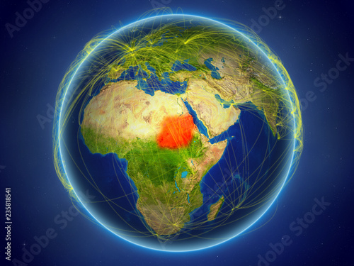 Sudan from space on planet Earth with digital network representing international communication  technology and travel.