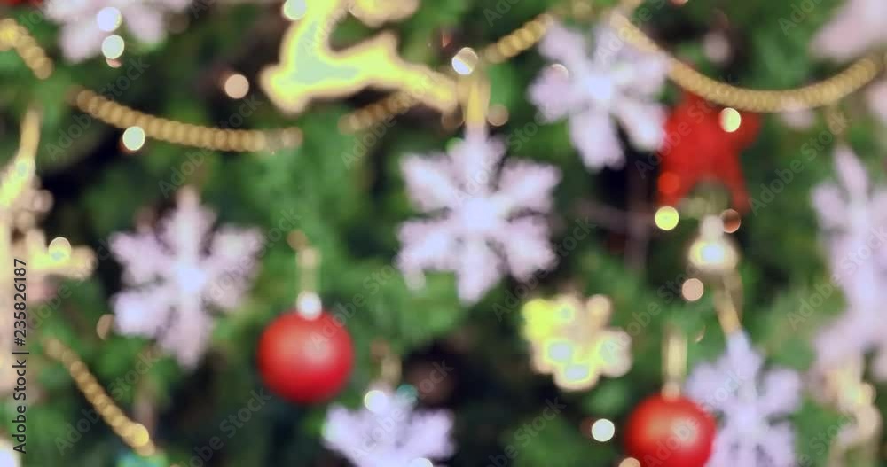 Close up scene VDO of blur Christmas tree, then it turn to clear, there is beautiful Christmas tree with gorgeous ornaments, concept for Christmas celebration. Close up scene VDO of blur Christmas tree, then it turn to clear, there is beautiful Christmas tree with gorgeous ornaments, concept for Christmas celebration.