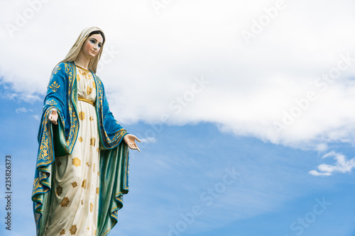 The Blessed Virgin Mary,mother of Jesus on the blue sky, in front of the Roman Catholic Diocese, public place in Chanthaburi, Thailand.