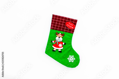 Traditional christmas stocking on white background top view copy space
