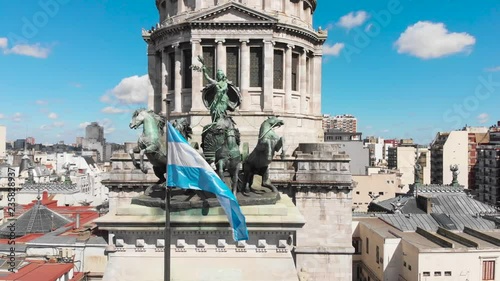 Aerial drone view of Buenos Aires national congress parliament building with dome roof, roman horse carriage statute and argentine flag photo