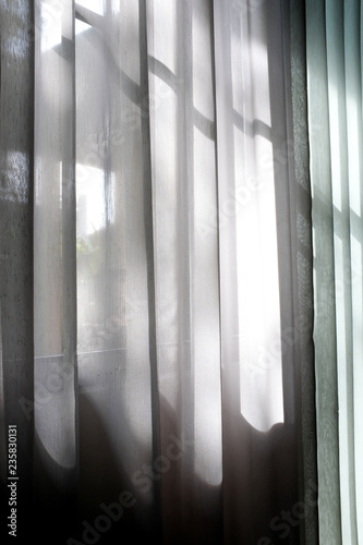 White transparent curtain and shadow of morning light