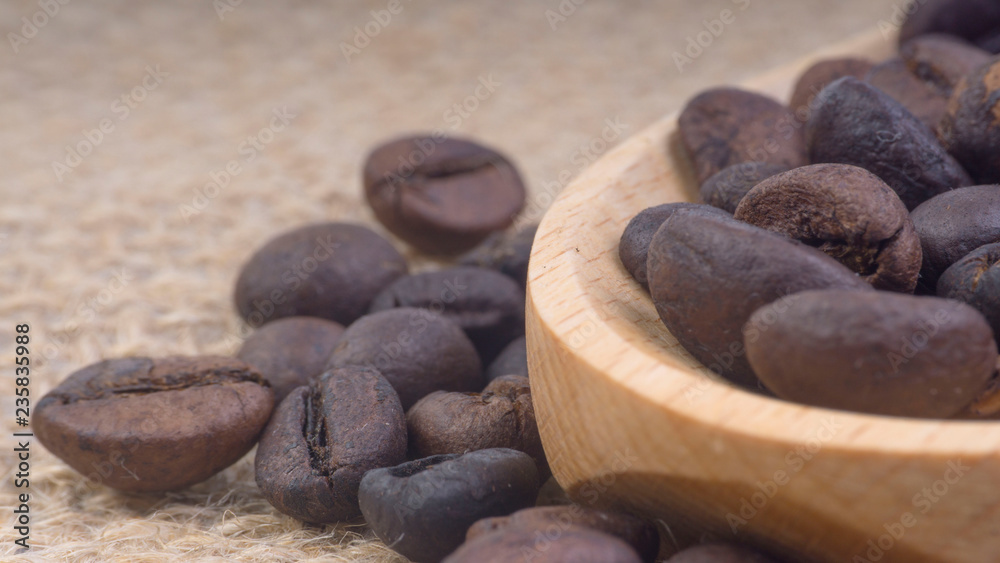 Fototapeta premium Coffee beans closeup with selective focus and crop fragment