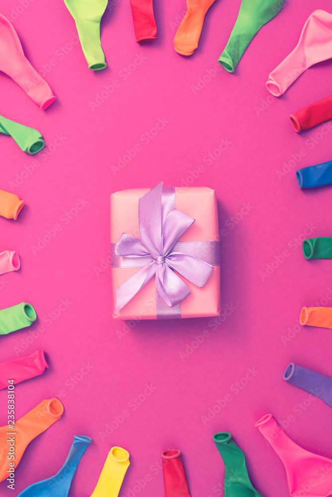 Set of colored balloons on pink background Flat lay top view Set of colored balloons on pink background Flat lay top view