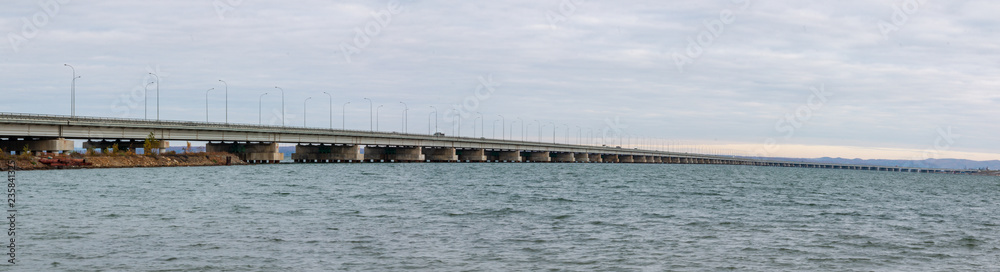 Low water bridge from Sedanka to the De Friz peninsula across the Amur Bay of Primorsky Krai Russia.