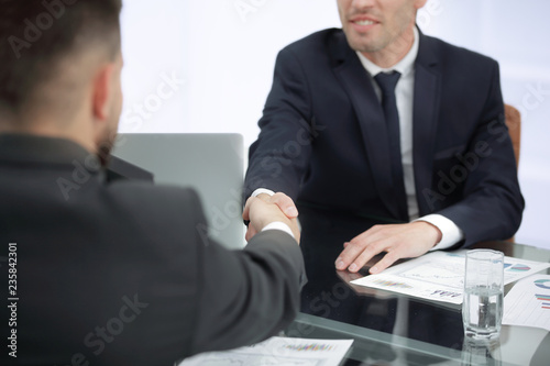 close up. handshake of business partners on a Desk