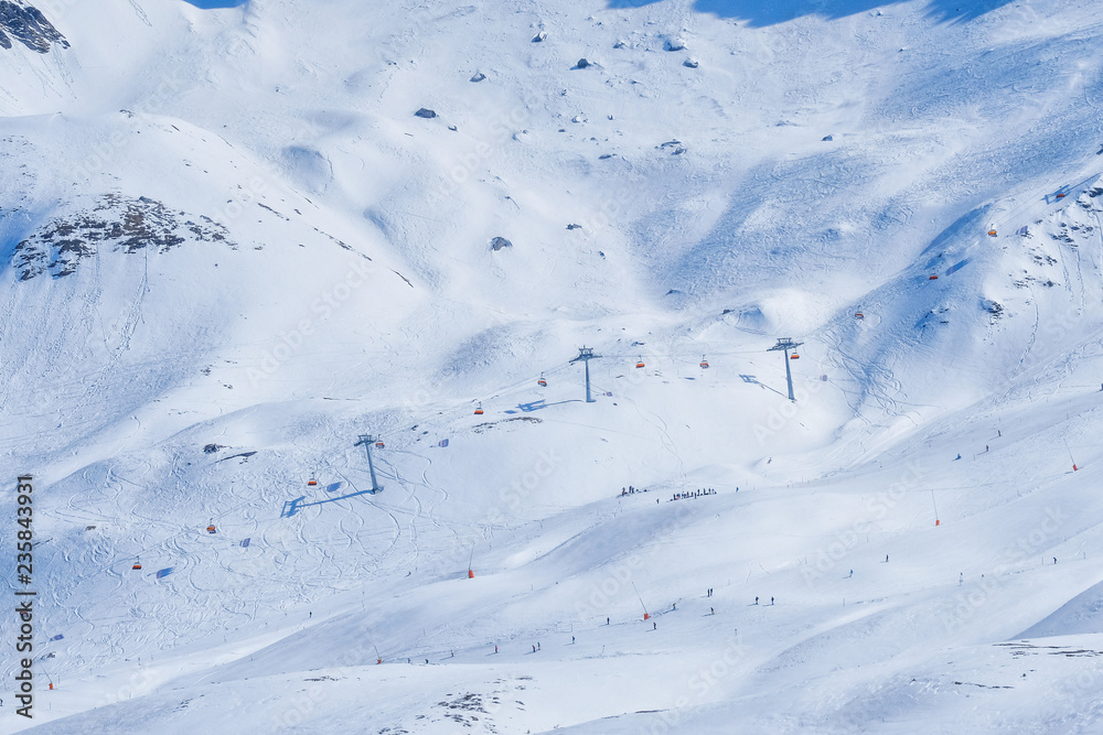 Panoramic view of ski chair lift in high mountains in Switzerland
