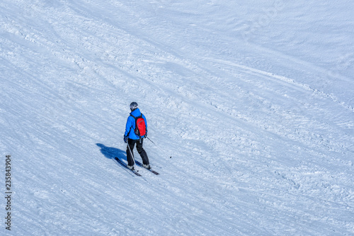 Skiers skiing at Kleine Scheidegg on a beautiful sunny day, Switzerland