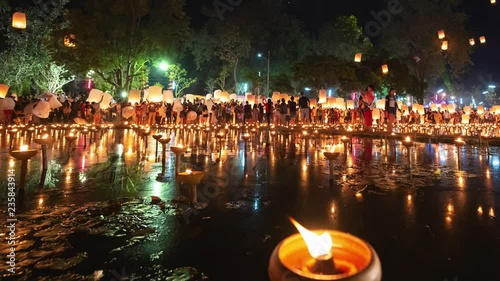 4K Timelapse of Floating lanterns and People in Yee Peng Festival or Loy Krathong celebration at Nong Bua, San  Kamphaeng, Chiang Mai, Thailand (Left-Right)