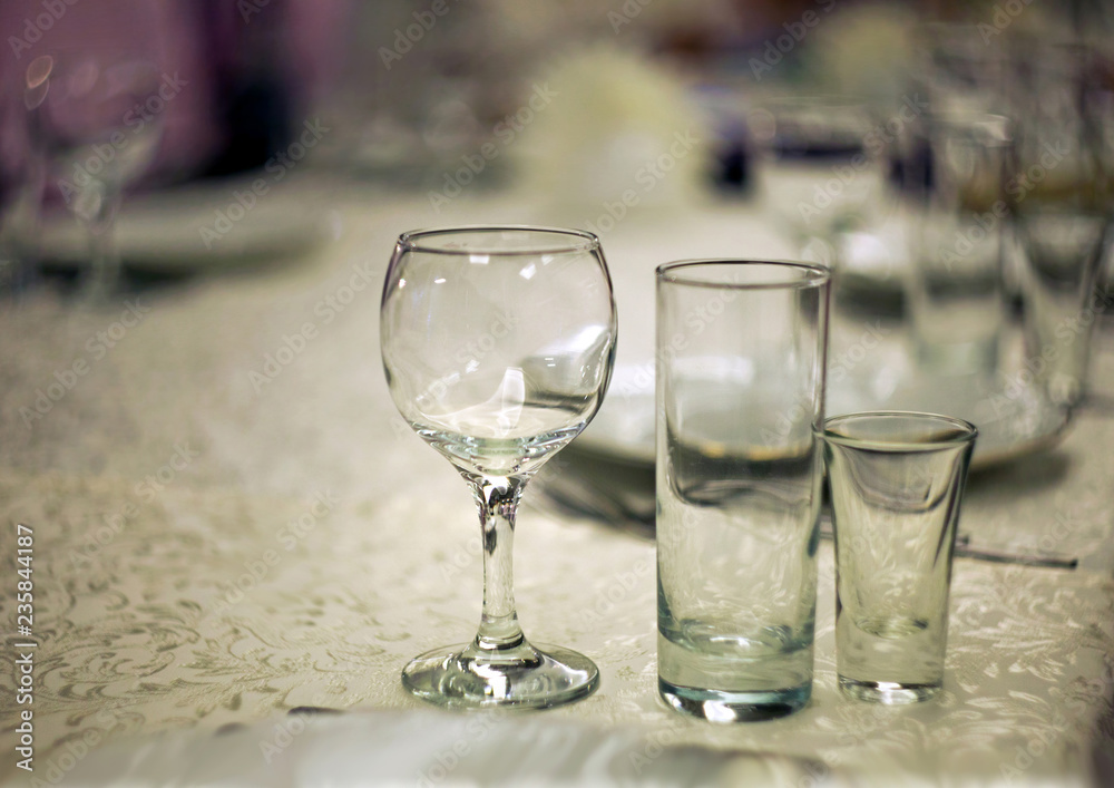 Wine glasses on the table in the restaurant with a beautiful blurred background and bokeh Wine glasses on the table in the restaurant with a beautiful blurred background and bokeh