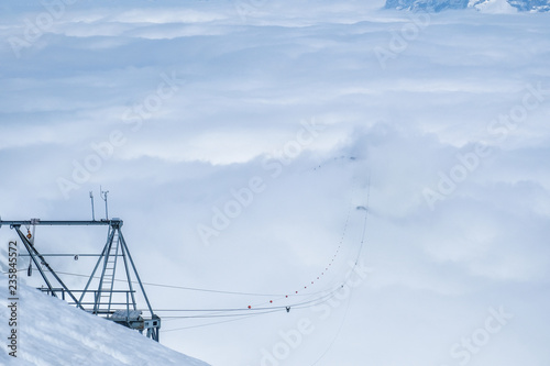 Cable car in the clouds to Schilthorn Mountain in winter, Switzerland