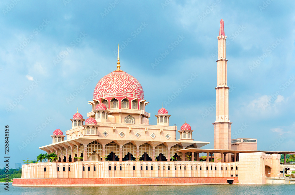 Malaysia, Cyberjaya, 2018-02-23: General view of the Putra Mosque with Putrajaya Lake, dramatic sky.