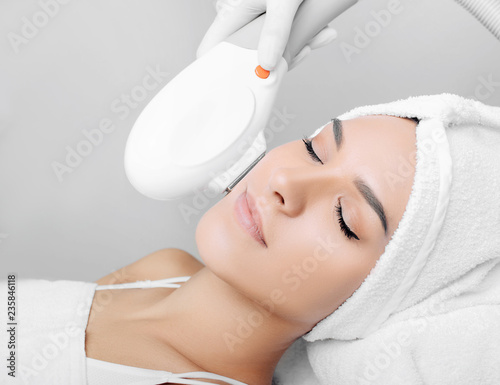 Photography woman receiving procedure, skin rejuvenation at beauty salon