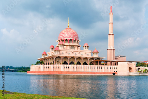 General view of the Putra Mosque with Putrajaya Lake, day with dramatic sky.