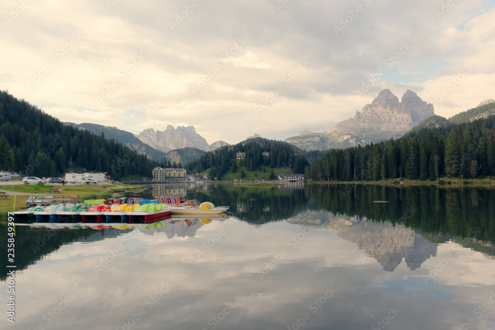 Auronzo di Cadore, Italy August 9, 2018: Misurina Mountain Lake. Beautiful tourist spot. catamarans on the water.