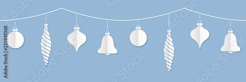 Vector illustration of a border of white paper Christmas ornaments against a blue background. Can be attached end to end seamlessly to make longer strings.