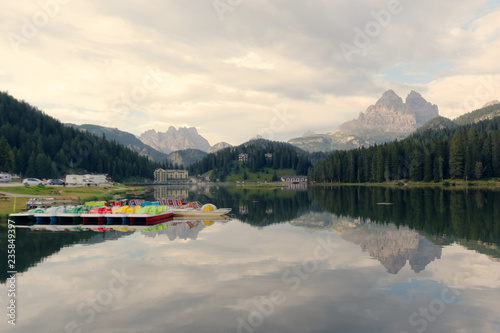 Auronzo di Cadore, Italy August 9, 2018: Misurina Mountain Lake. Beautiful tourist spot. catamarans on the water.