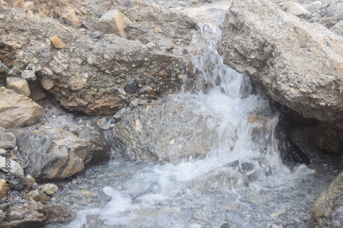 Water is falling between the rocks in Muzaffarabad, Azad Kashmir.