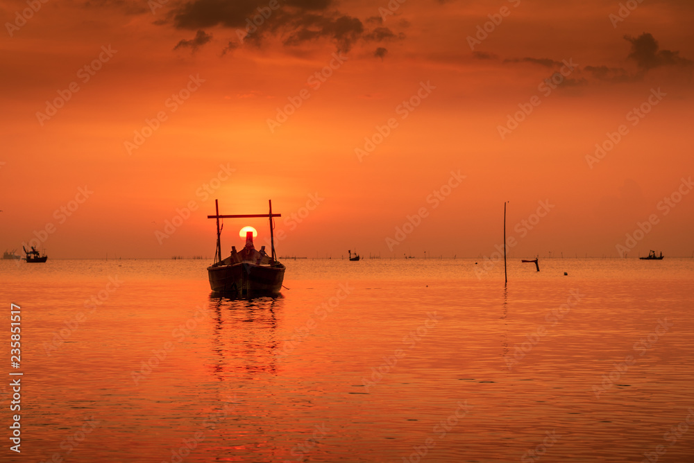Fototapeta premium Landscape on the beach with wooden fishing boat and sunset twilight.