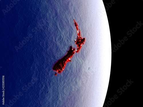 Satellite view of New Zealand at night with visible bright city lights. Extremely fine detail of the plastic planet surface.
