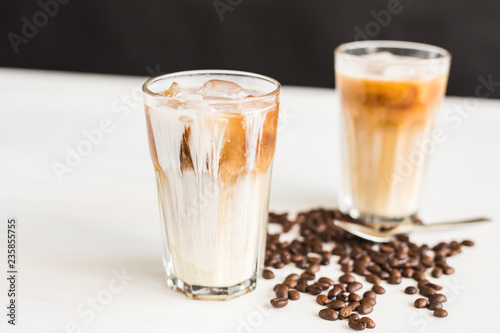 Delicious drink concept - Iced coffee in a glass with ice.