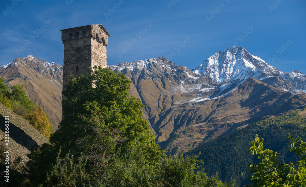 Old stone tower among high mountains