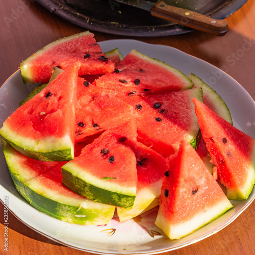 Sliced tasty watermelon on a large plate
