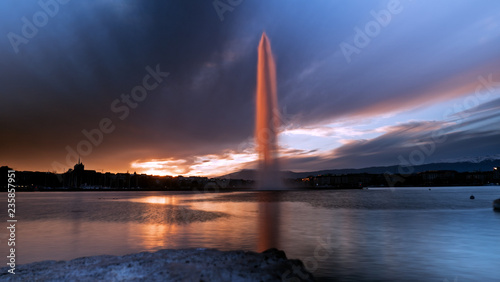 Sunset hitting the famous jet D`Eau in Geneva, Switzerland.