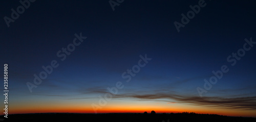 Panoramic view of the cloudless sky during sunset. photo